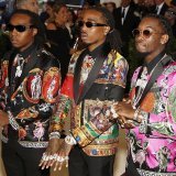 Takeoff, à gauche, avec son groupe Migos, en 2018.